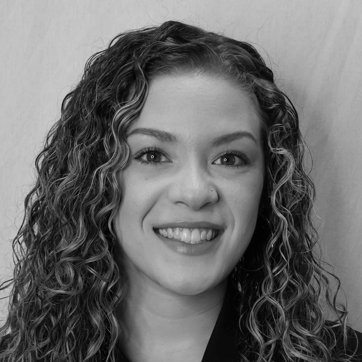 Portrait of Arianna O., a professional stylist at Cameo Salon & Spa, showcasing their expertise and style.