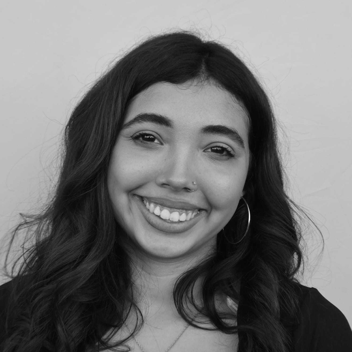 Portrait of Yesinia S., a professional stylist at Cameo Salon & Spa, showcasing their expertise and style.