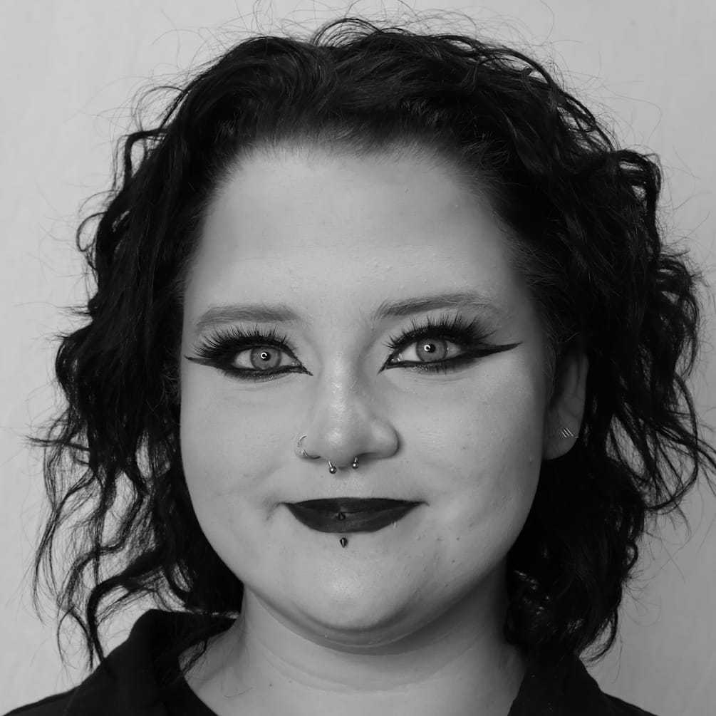 Portrait of Ale S., a professional stylist at Cameo Salon & Spa, showcasing their expertise and style.