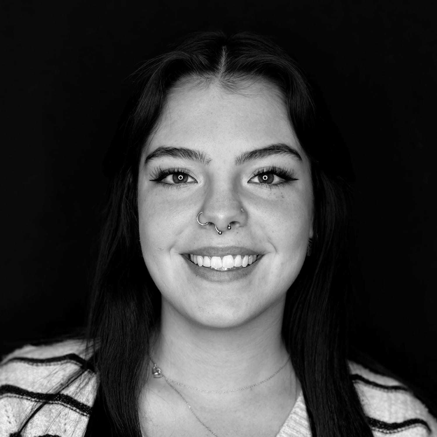 Portrait of Lara D., a professional stylist at Cameo Salon & Spa, showcasing their expertise and style.