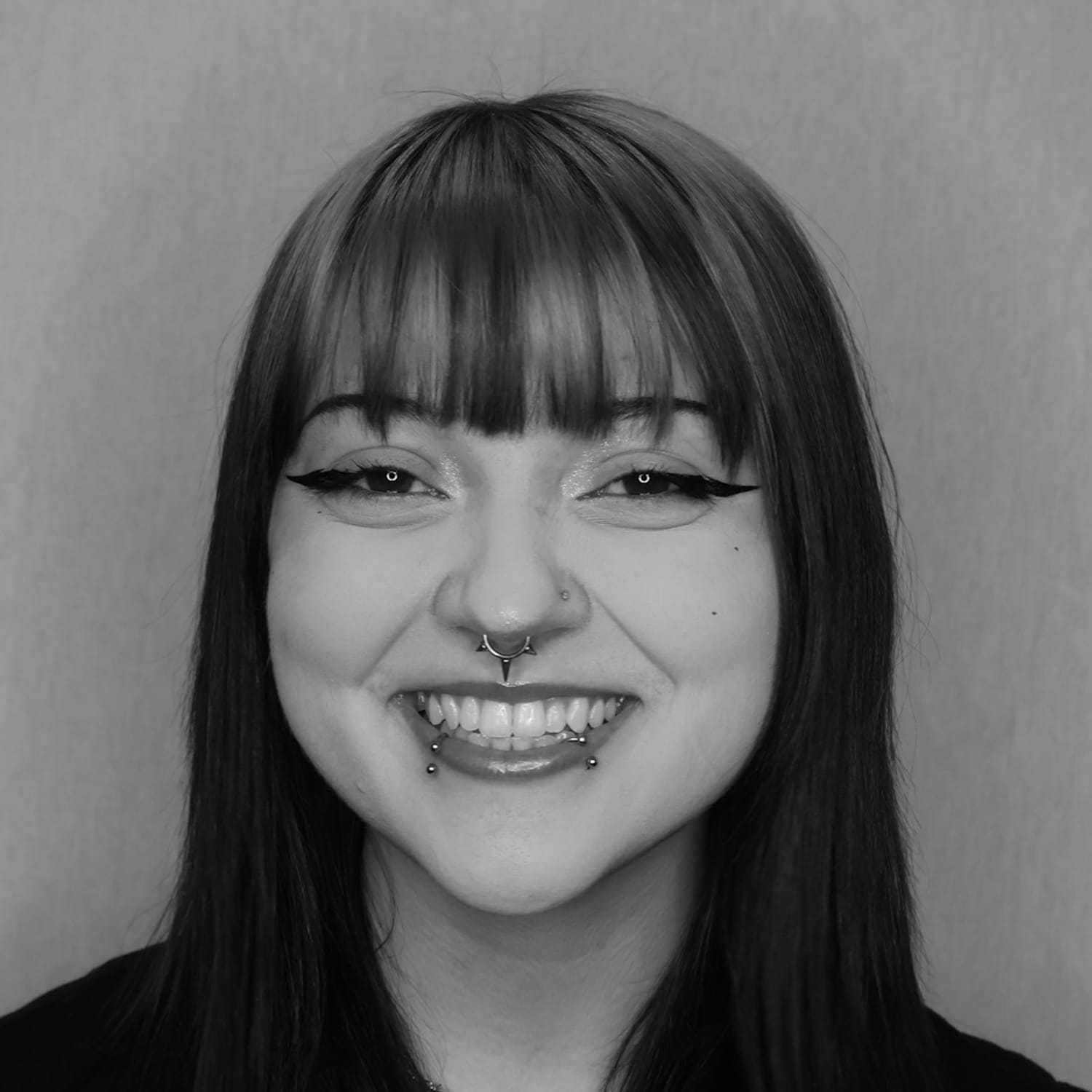 Portrait of Emmy B., a professional stylist at Cameo Salon & Spa, showcasing their expertise and style.