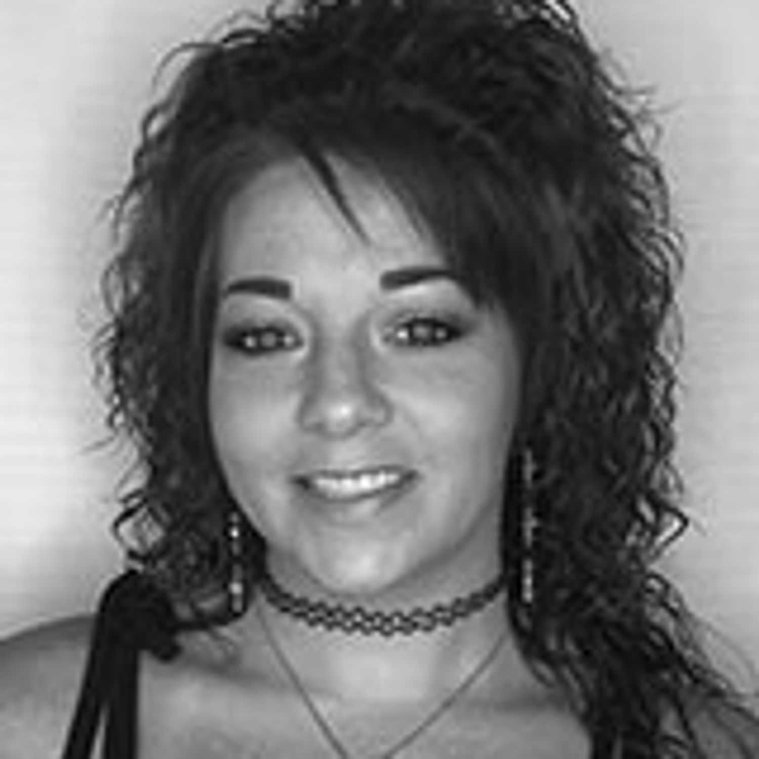 Portrait of Sasha V., a professional stylist at Cameo Salon & Spa, showcasing their expertise and style.