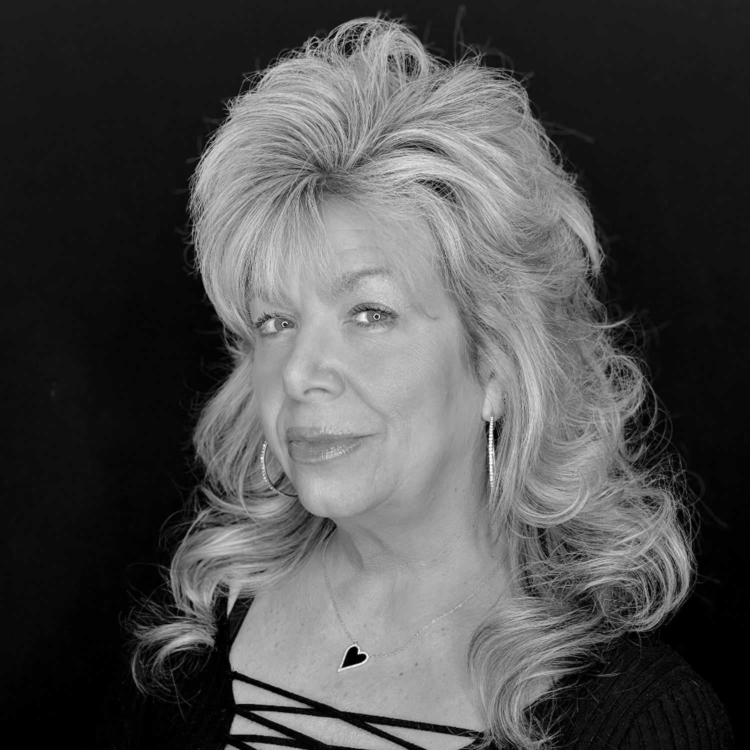 Portrait of Elaine S., a professional stylist at Cameo Salon & Spa, showcasing their expertise and style.