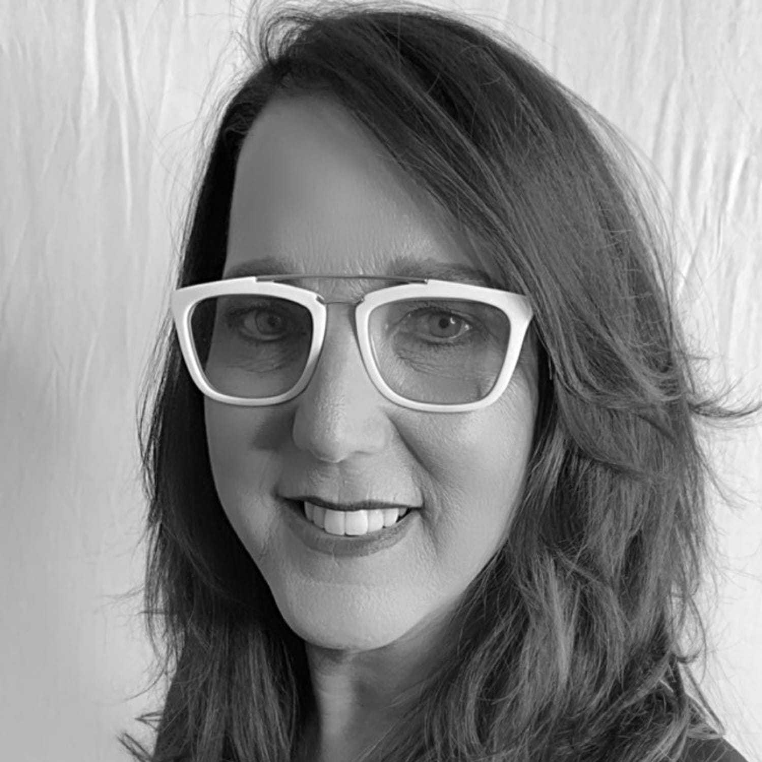 Portrait of Lori M., a professional stylist at Cameo Salon & Spa, showcasing their expertise and style.