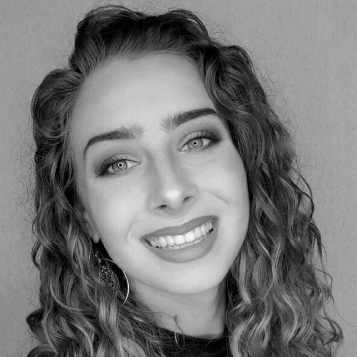 Portrait of Tianna J., a professional stylist at Cameo Salon & Spa, showcasing their expertise and style.